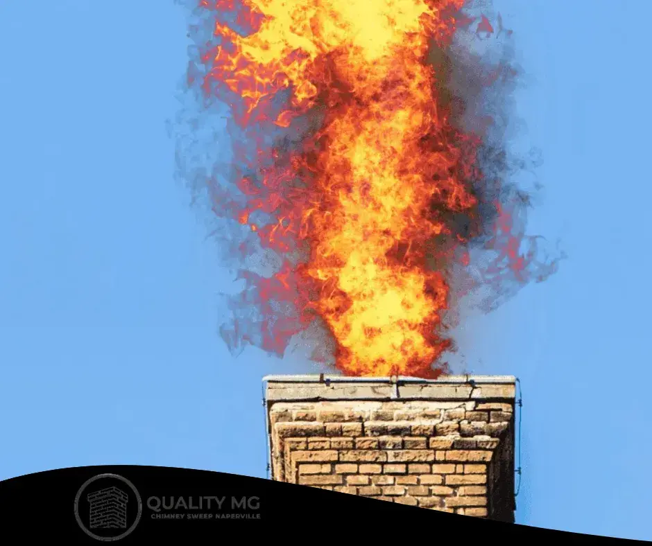 An old brick chimney showing signs of neglect, including cracks and soot buildup.